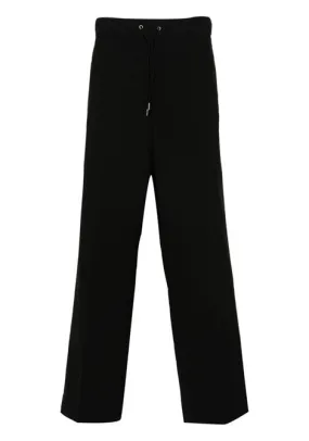 Pantaloni crop a gamba ampia in nero - uomo