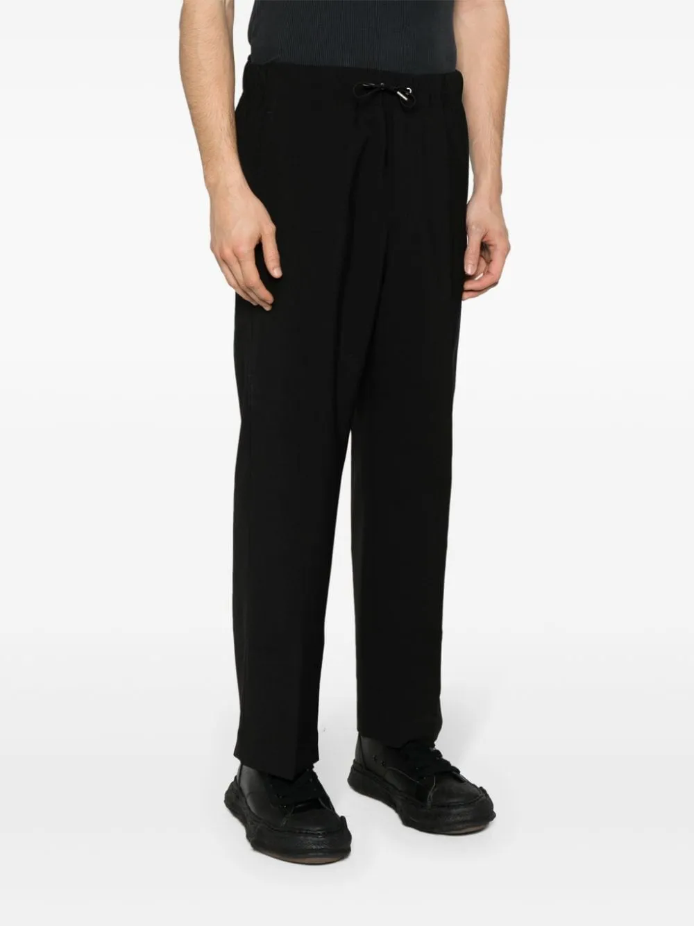 Pantaloni crop a gamba ampia in nero - uomo